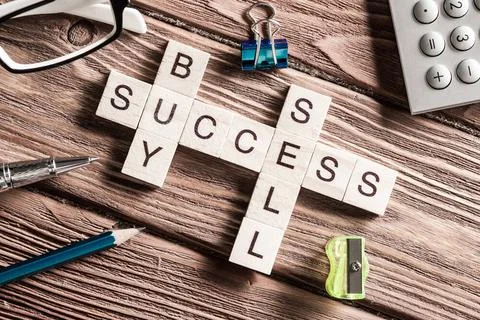 Conceptual business keywords on table with elements of game making crosswo... Stock Photos
