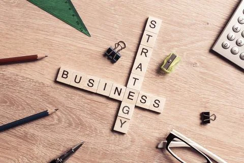 Conceptual business keywords on table with elements of game making crosswo... Stock Photos