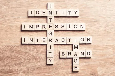 Conceptual business keywords on table with elements of game making crossword Stock Photos