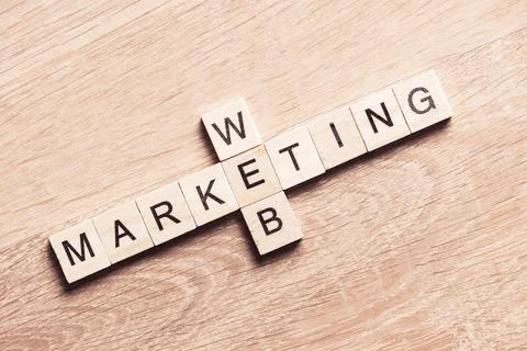 Conceptual business keywords on table with elements of game making crossword Stock Photos