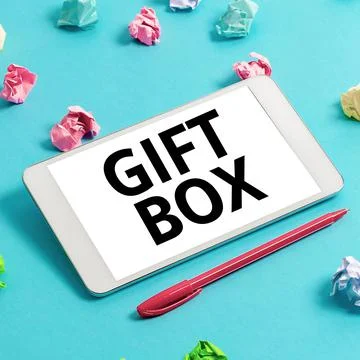 Conceptual caption Gift Box. Concept meaning A small cointainer with designs Stock Photos