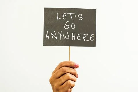 Conceptual caption Lets Go Anywhere. Business showcase visit new places to meet Stock Photos