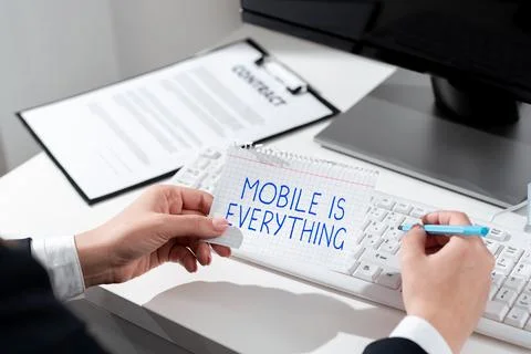 Conceptual caption Mobile Is Everything. Word Written on Handheld Computer Stock Photos
