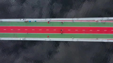 Conceptual composition lines  red and green bridge, river and sky reflection Vídeo Stock 111337005