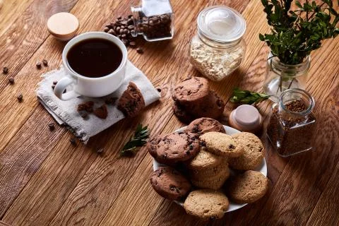 Conceptual composition with two jars of coffee beans, instant coffee and tasty Stock Photos