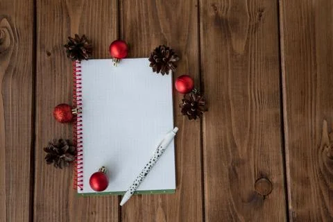 Conceptual composition on a wooden table with notebook with plans for the yea Stock Photos