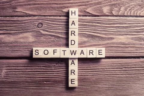 Conceptual computer keywords on table with elements of game making crossword 库存照片