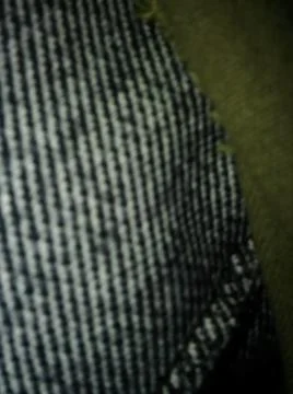 Conceptual dark textile pattern with different elements  with shadows and lig Stock Photos