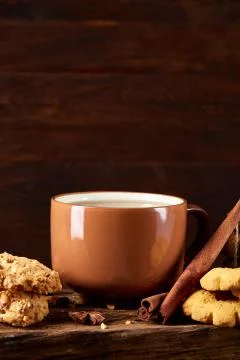 Conceptual festive composition with a cup of hot tea, cookies and spicies on a Stock Photos