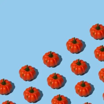 Conceptual halloween pattern with decorative pumpkin on a blue background. Stock Photos
