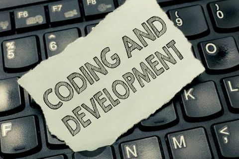 Conceptual hand writing showing Coding And Development. Business photo text Stock Photos