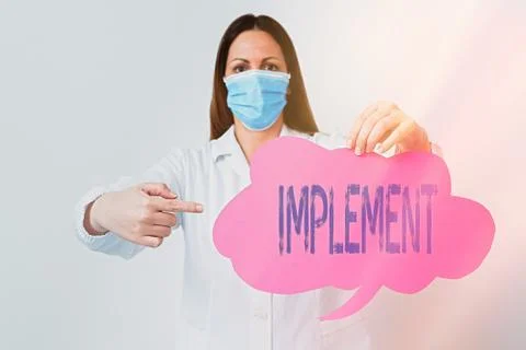 Conceptual hand writing showing Implement. Business photo showcasing give Foto stock