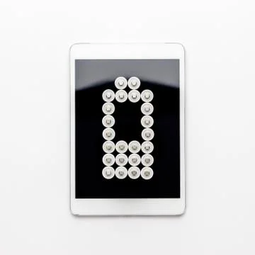Conceptual image of battery charge level pictogram on tablet computer Stock Photos