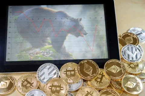 Conceptual image for cryptocurrency bubble. Bear market on tablet graph Stock Photos