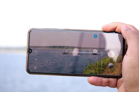 Conceptual image of a dam captured through mobile lens with camera Foto stock