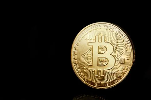 Conceptual image of different cryptocurrency with bitcoins on dark table, close Stock Photos