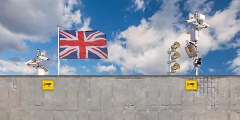 Conceptual image of an English border security wall with United Kingdom fla.. Stock Photos