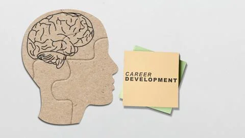 A conceptual image featuring a cardboard head silhouette with a brain drawi.. Stock Photos