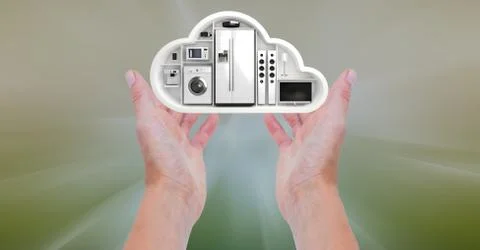 Conceptual image of hand holding a cloud shape with home appliance Foto stock