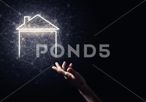 Conceptual image with hand pointing at house or main page icon o Stock Photos