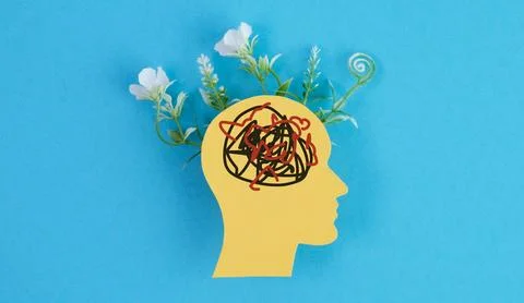 Conceptual image of a human head profile with tangled scribbles and bloomin.. Stock Photos