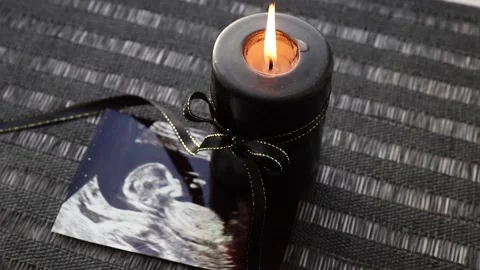 Conceptual image of mourning, miscarriage, pregnancy loss or grief. Video stock 221908329