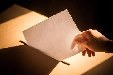 Conceptual image of a person voting during elections Stock Photos
