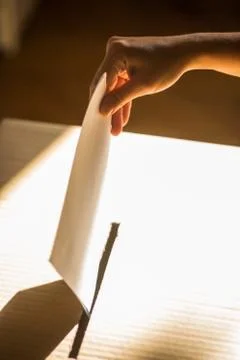 Conceptual image of a person voting during elections Stock Photos