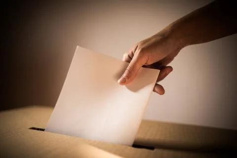 Conceptual image of a person voting during elections Stock Photos