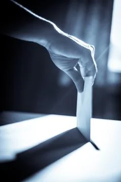 Conceptual image of a person voting during elections Stock Photos
