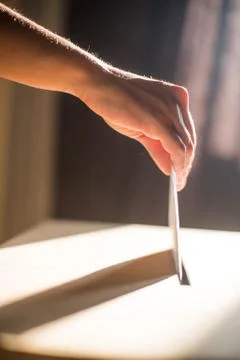 Conceptual image of a person voting during elections Stock Photos