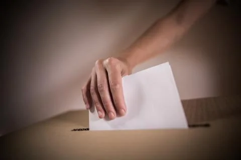 Conceptual image of a person voting during elections Stock Photos