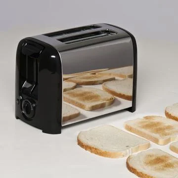 Conceptual image of toaster with bread Stock Photos