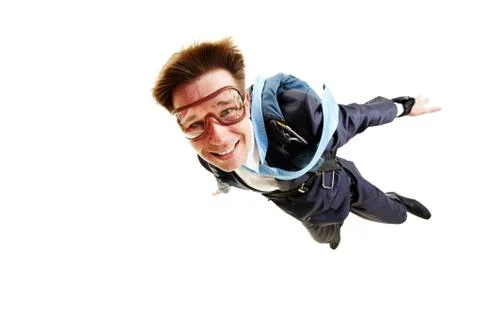 Conceptual image of young businessman flying with parachute on back 스톡 사진