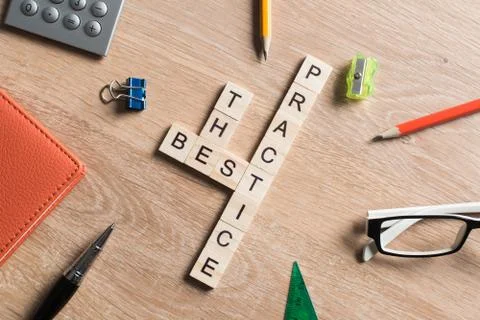Conceptual keywords on wooden table with elements of game making crossword Stock Photos
