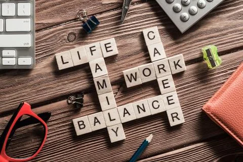 Conceptual keywords on wooden table with elements of game making crossword Stockfoto's