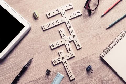 Conceptual keywords on wooden table with elements of game making crossword Stock Photos