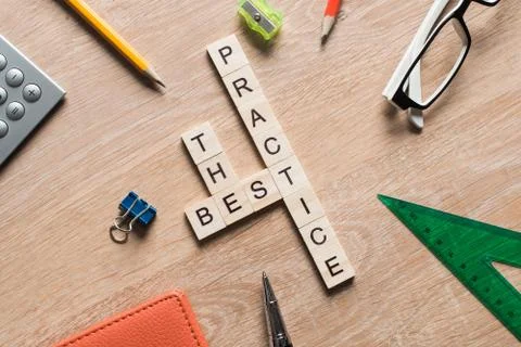 Conceptual keywords on wooden table with elements of game making crossword Stock Photos