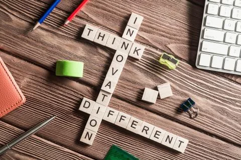 Conceptual keywords on wooden table with elements of game making crossword Stock Photos