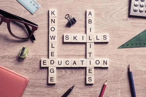Conceptual keywords on wooden table with elements of game making crossword Stock Photos