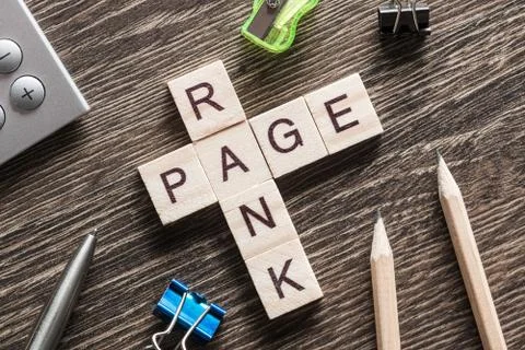 Conceptual media keywords on table with elements of game making crossword Stock Photos