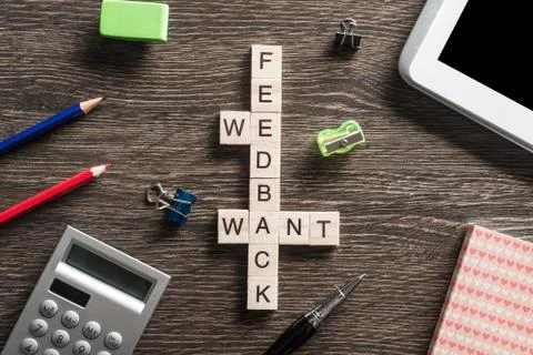 Conceptual media keywords on table with elements of game making crossword Foto stock