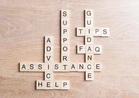 Conceptual media keywords on table with elements of game making crossword Stock Photos