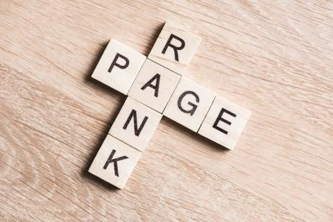 Conceptual media keywords on table with elements of game making crossword Stock Photos