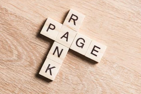 Conceptual media keywords on table with elements of game making crossword Stock Photos