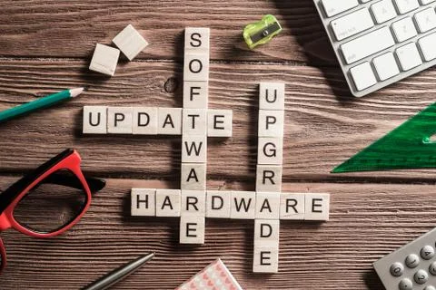 Conceptual media keywords on table with elements of game making crossword Stock Photos