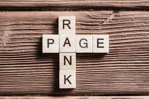 Conceptual media keywords on table with elements of game making crossword Stock Photos