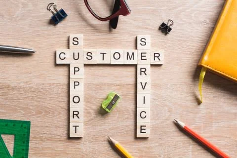 Conceptual media keywords on table with elements of game making crossword Stock Photos