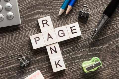 Conceptual media keywords on table with elements of game making crossword Foto stock