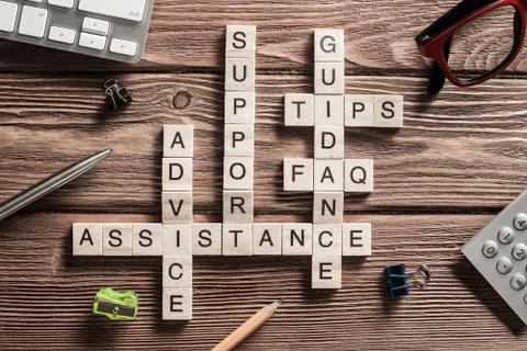 Conceptual media keywords on table with elements of game making crossword Foto stock